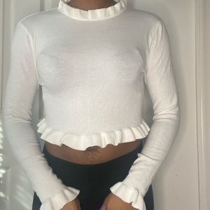 White ruffled turtleneck